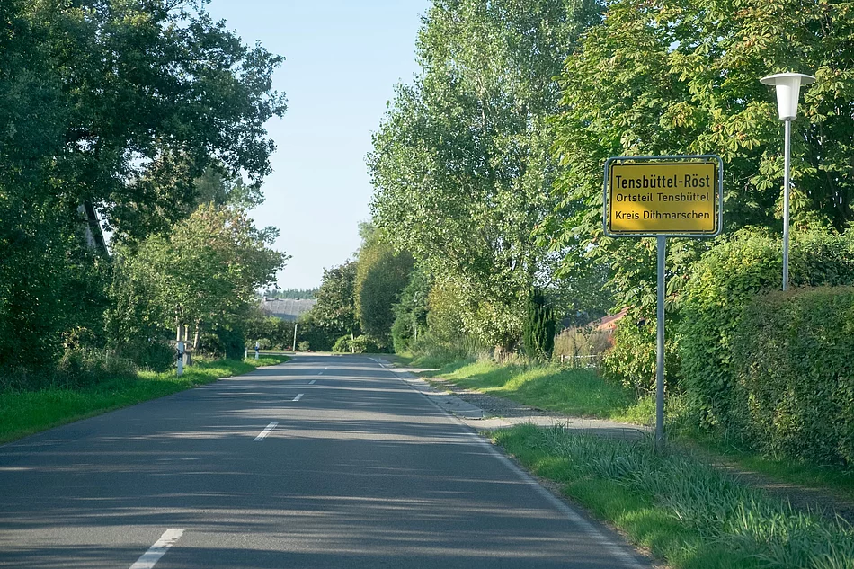 Ortsschild Tensbüttel-Röst Ortsschild Tensbüttel-Röst